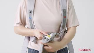 BABYBJÖRN  How to adjust the size on Baby Carrier Mini [upl. by Herrah401]