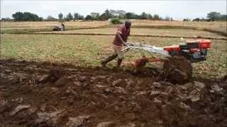 Power tiller operation by plough and ratavator at irrigation farm [upl. by Saber]